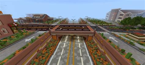 An Aerial View Of A Train Station With Trees And Flowers In The Foreground