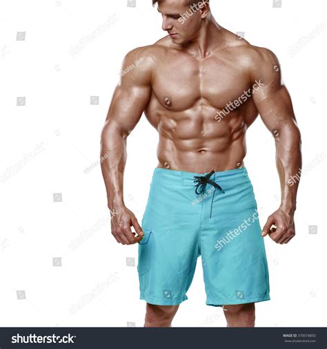 Sexy Athletic Man Showing Muscular Body And Sixpack Abs Isolated Over