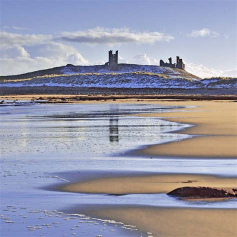 Dunstanburgh Castle and Embleton Bay in winter - Simon Fraser Photo