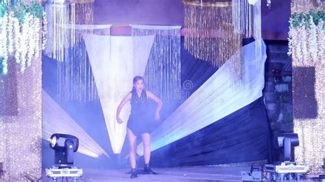 Asian Beautiful Woman On Small Lights Glittered Stage Performs As She Joins The Local Amateur