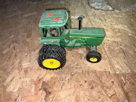 Vintage John Deere toy tractor - Metzger Property Services LLC