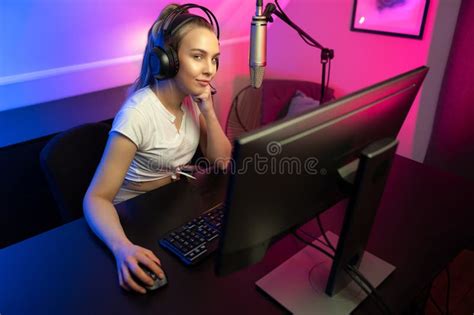 Happy Beautiful Blonde Gamer Girl Playing Online Video Game On Her Personal Computer Stock
