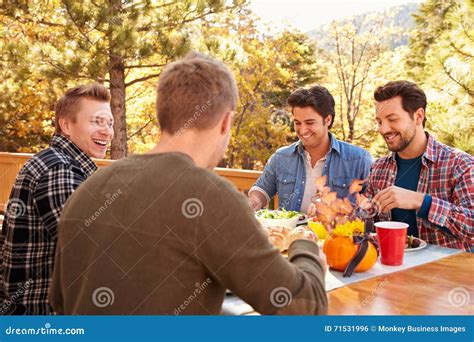 Group Of Gay Male Friends Enjoying Outdoor Meal Together Stock Photo Image Of Meal People