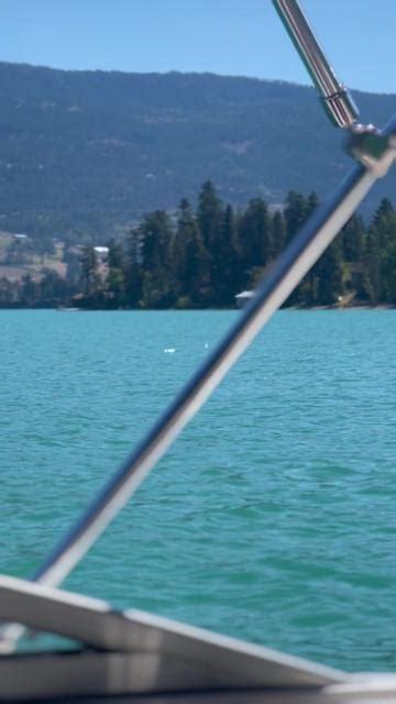 Blue Calm Lake Water Boating In Mountains British Columbia Gridbank