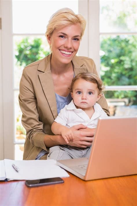 Smiling Pretty Blonde With His Son Using Laptop Stock Photo Image Of