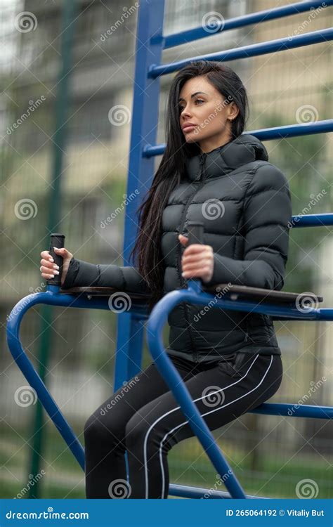 Long Haired Slender Brunette Goes In For Sports On A Street Sports Ground Stock Photo Image Of