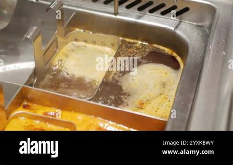 Pov Close Up View To Hotpot Full With Mala Hot Spice Soup In Chinese Style In Chinese Restaurant