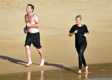 Retro Bikini Lara Bingle Strikes A Black Bikini As She Gives Up Fight To Contain In Sydney Beach
