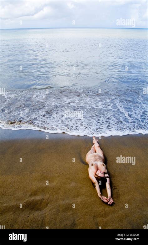 Naked Woman Lying On The Beach Elevated View Stock Photo Alamy