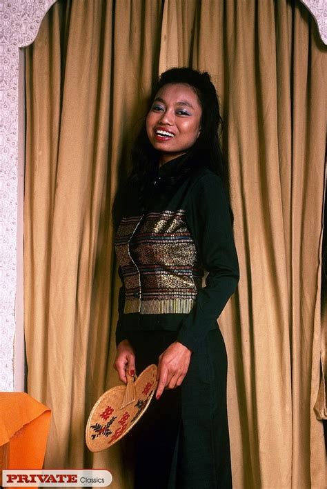 Asian Babe Opens Her Black And Gold Blouse XXX Dessert Picture