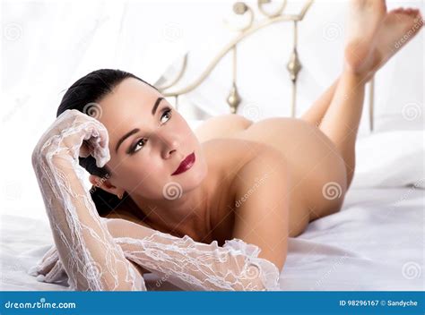 Nude Sensual Woman In Lacy Gloves Lying On A Bed And Posing In Bedroom Stock Image Image Of