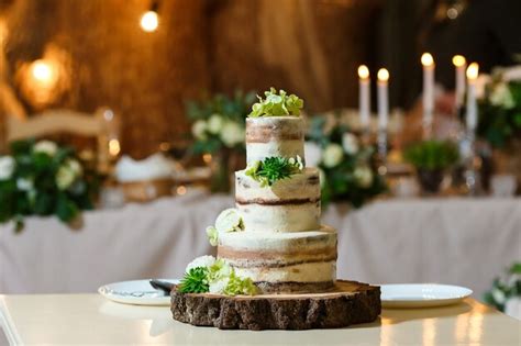 Premium Photo Naked Wedding Cake Decorated With Fresh Flowers