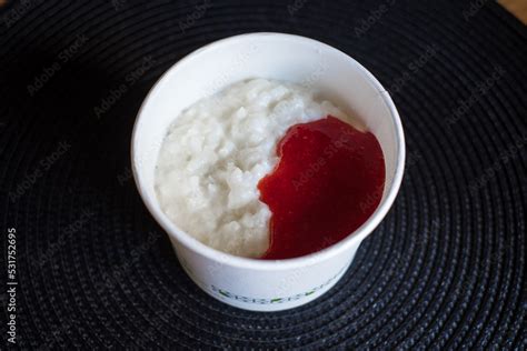 Rice Flake Porridge In A White Round Carton Take Away Box With Fresh