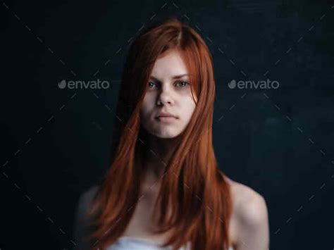 Red Haired Woman Naked Shoulders Dark Background Glamor Stock Photo By Shotprime
