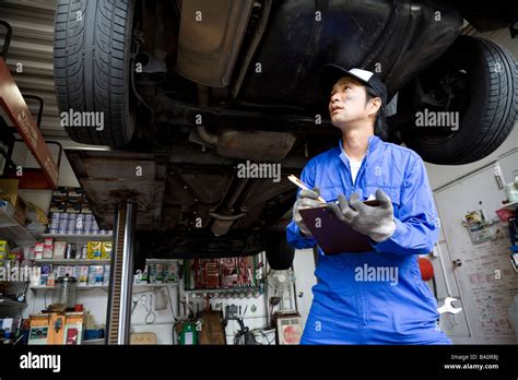 Mechanic Checking Car Stock Photo Alamy