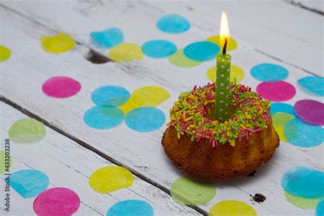 Colorful birthday cake with confetti around Stock Photo | Adobe Stock