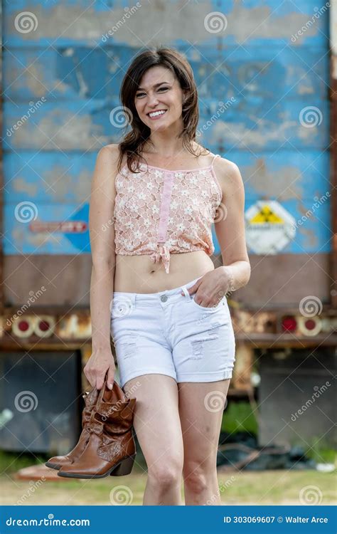 Campus Elegance Brunette Beauty Strikes A Pose Capturing The Essence Of Academic Glamour Stock