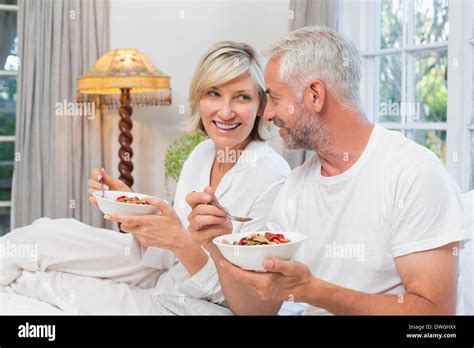 Mature Couple Having Breakfast In Bed Stock Photo Alamy