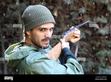 Ethnic Hunter With Camouflage Green Clothing Stock Photo Alamy