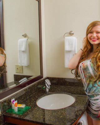 Cute Busty Coed Hanna Bollie Strips Out Of Her Dress On The Leather Couch Porn Pictures XXX