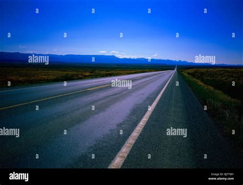 Straight Road Through Landscape Stock Photo Alamy