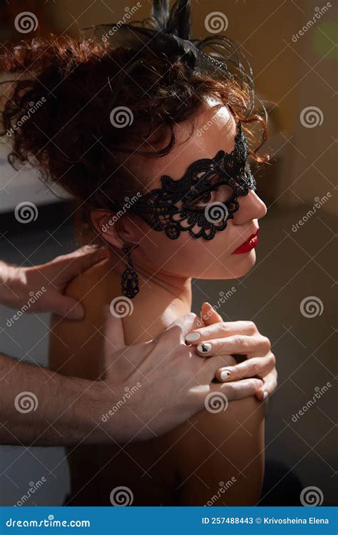 Mysterious Brunette Girl In Black Mask With Bare Back Model Posing In Studio Stock Image