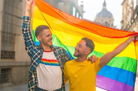 Premium Photo Portrait Of Gay Male Couple With Rainbow Flag At Pride Party In The City Lgbt