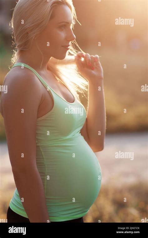 Profile Of Pregnant Blonde With Pensive Look Stock Photo Alamy