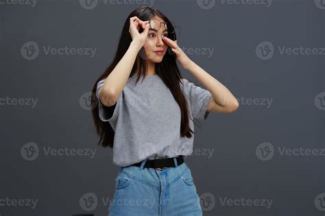 Pretty Woman In Round Glasses Smile Posing Close Up Gray Background