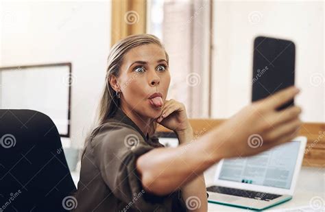 Phone Selfie With A Playful Business Woman Having Fun Being Goofy And