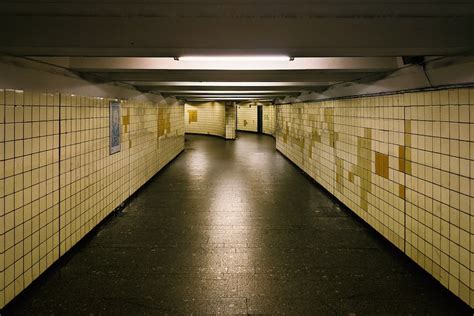 A hallway with yellow and black tiles photo – Free Arbat Image on Unsplash