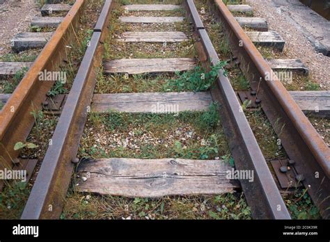 An Old Abandoned Railway Overgrown With Green Grass Stock Photo Alamy