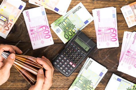 Premium Photo | Top view man counting money with calculator