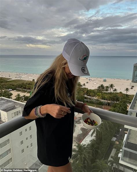 Sophie Habboo Flaunts Her Figure In A White Bikini And Crochet Sarong As She Soaks Up The Sun In