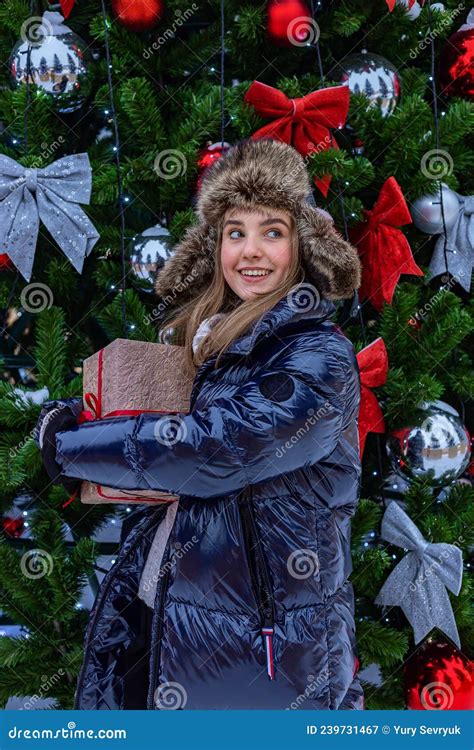 Happy Smiling Blonde Girl With Christmas Present Cute Attractive Teenager Girl Of Caucasian