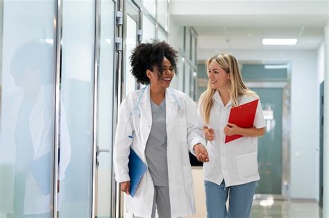 Free Photo Front View Smiley Doctors At Work