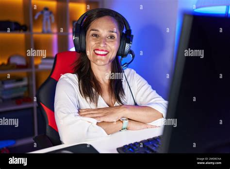 Middle Age Brunette Woman Playing Video Games Happy Face Smiling With Crossed Arms Looking At