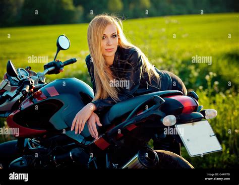 Sexy Fashion Female Biker Girl Blonde Woman In Leather Jacket Sitting On Vintage Custom