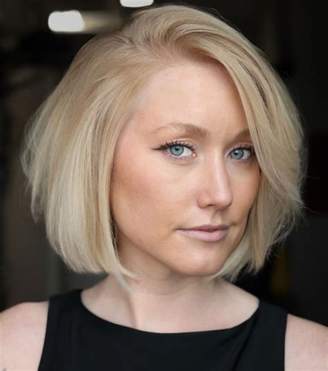 Voluminous Side Parted Blonde Bob Hairstyle