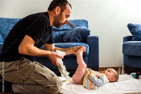 Dad Cleaning His Baby S Dirty Ass Changing The Stinky Diaper With A