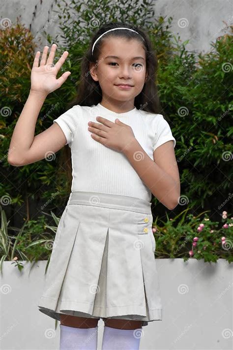 Asian Preteen Pledging Allegiance Wearing Skirt Stock Image - Image of
