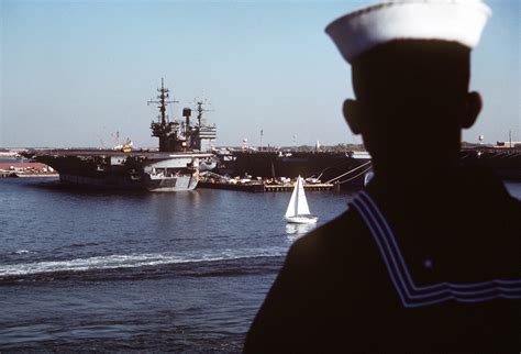 A Sailor Mans The Rails Aboard The Amphibious Assault Ship USS WASP