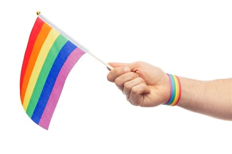 Premium Photo Hand With Gay Pride Rainbow Flag And Wristband
