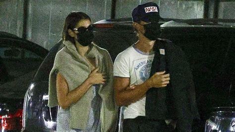 Kaia Gerber holds boyfriend Austin Butler's arm as they step out for