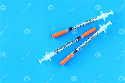 Insulin Syringes On A Blue Background Diabetes Treatment Stock Image
