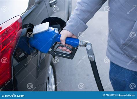 Pumping Gas At Gas Pump Closeup Of Man Pumping Gasoline Fuel In Stock