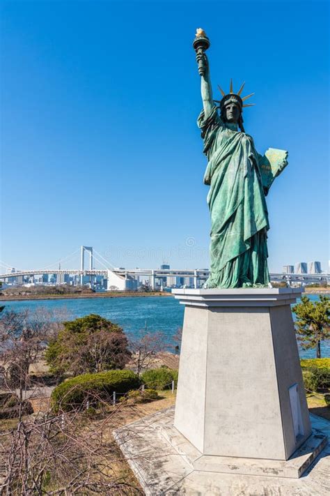 Statue Of Liberty And Rainbow Bridge In Odaiba Tokyo Japan Stock