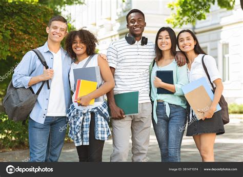 Group Of International University Students Posing Outdoors In Campus