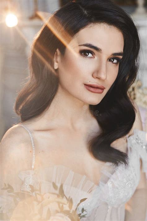 Beautiful And Sensual Brunette Model Girl In Stylish Lace Dress With Naked Shoulders Posing In