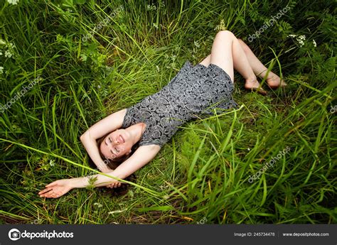 Brunette Woman Lying Green Grass Beauty Girl Outdoors Enjoying Nature Stock Photo By Luljo